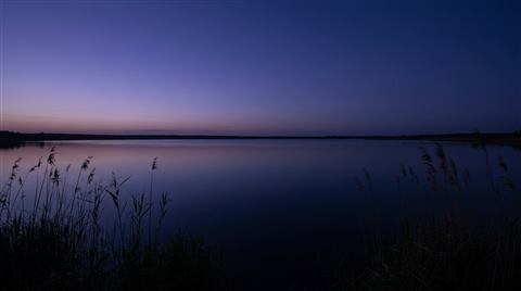 Lake reflecting twilight sky